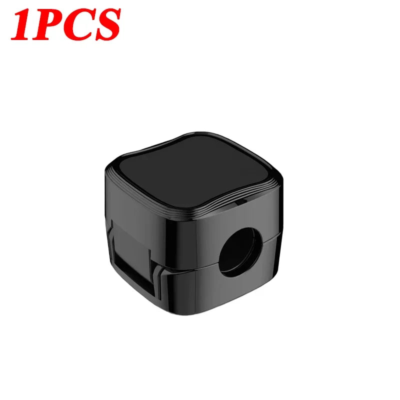Black pencil sharpener on a white background with '1PCS' text in red.
