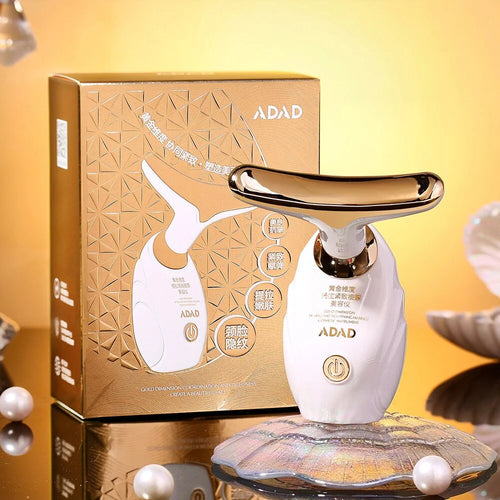 White beauty device with gold accents on a reflective surface, next to its packaging box with 'ADAD' branding.