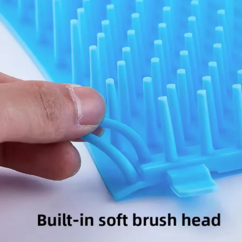 Blue soft brush head with a hand holding it, on a white background