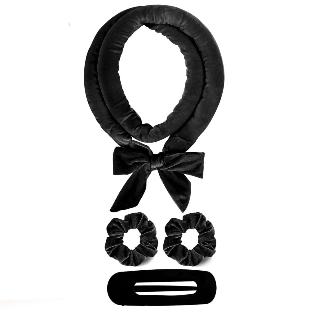 Black hair scarf with bow, scrunchies, and barrette on a white background