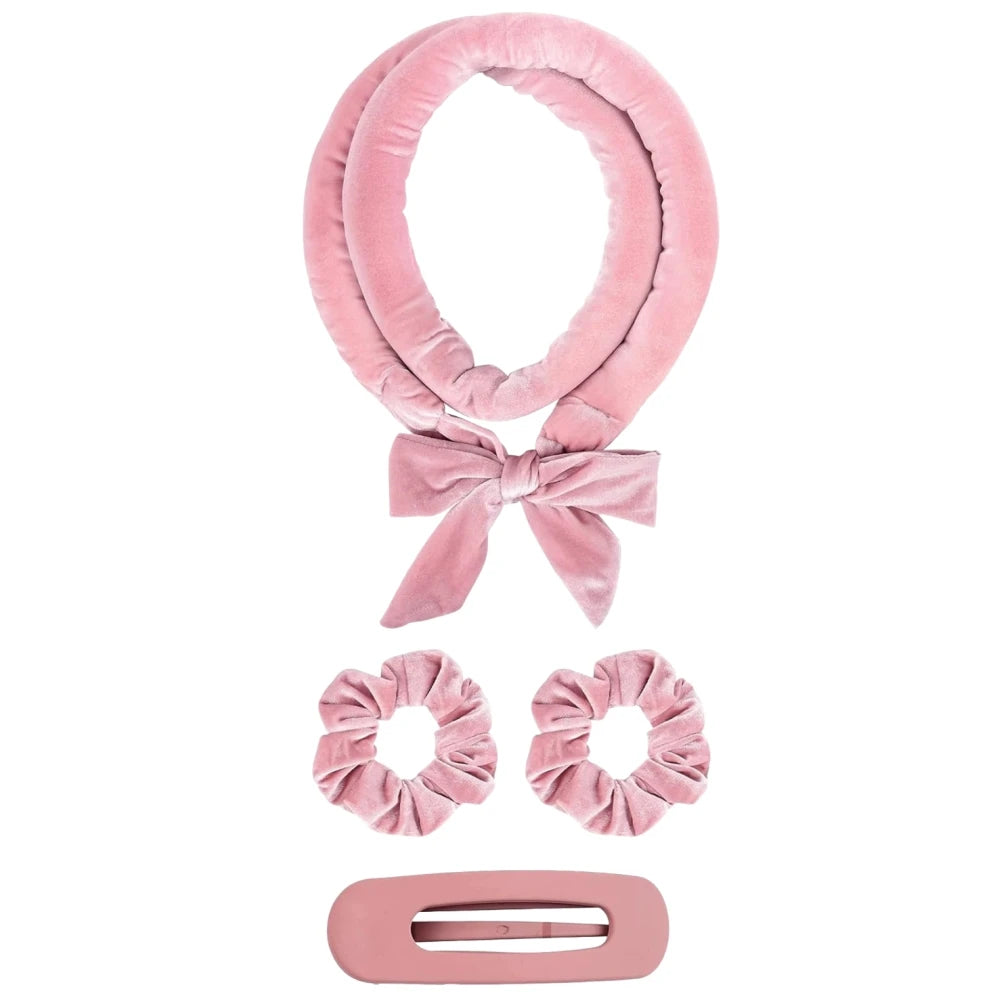 Pink hair accessory set with headband, scrunchies, and clip on a white background